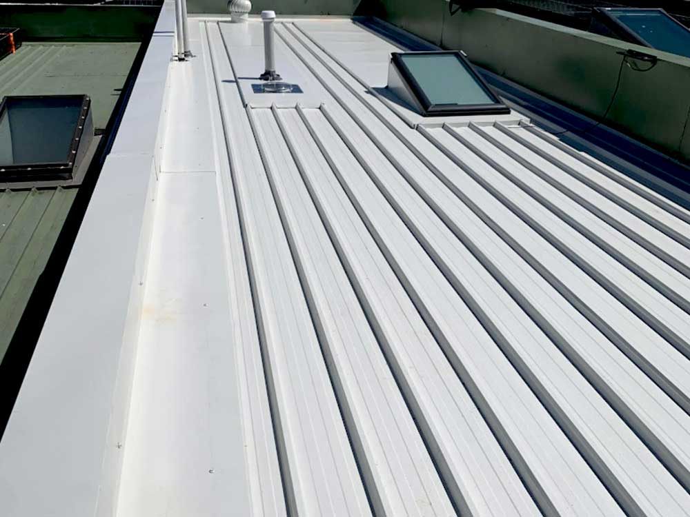 Freshly coated roof surface after repair work